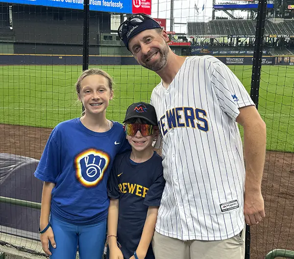 Judah with his kids at a Brewers game